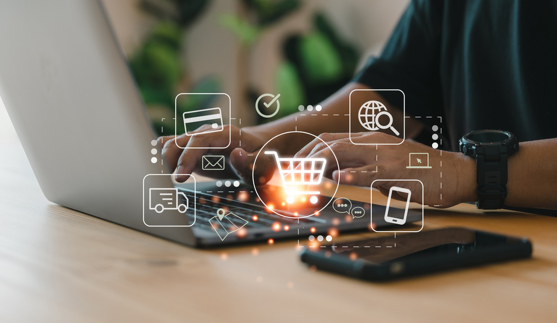 The Ultimate Guide to Creating an Ecommerce Sales Strategy Person using laptop showing ecommerce platform features, signifying business success with strategies for ecommerce sales