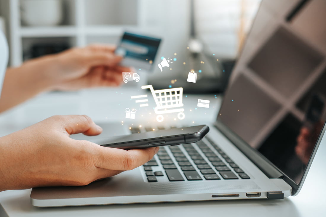 Top B2B Ecommerce Marketing Strategies for 2024 Person using smartphone and credit card, indicating digital shopping success with ecommerce marketing agency services