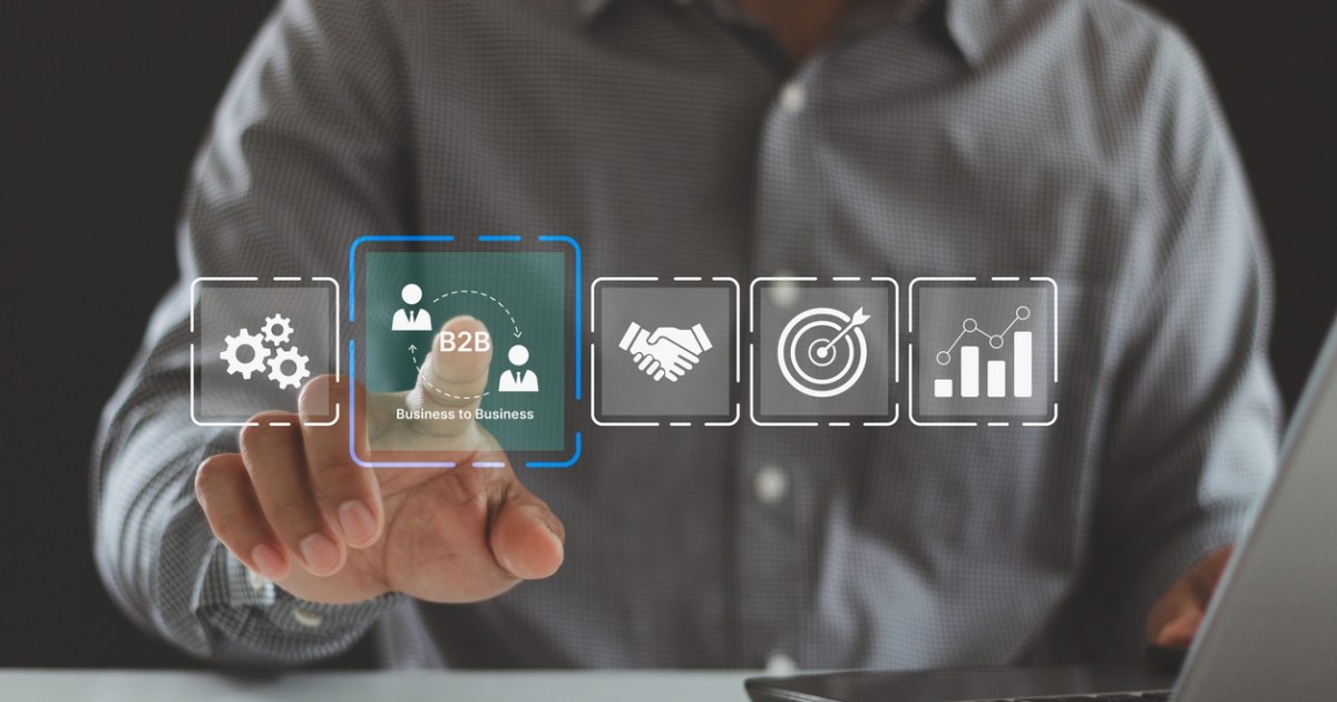 Business professional selecting B2B icon on digital interface showcasing use of self-service portals for B2B commerce success